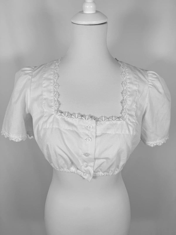 Blouse blanche courte à manches bouffantes